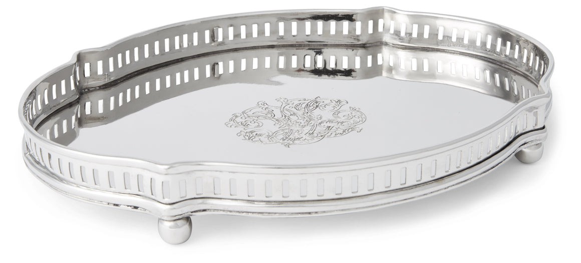 The distinctively detailed design of this Chippendale-style tray brings a tastefully elegant presentation when serving canapes or drinks to your guests, or holding glassware on your bar. Also lends a sophisticated look to your bedroom when used as a vanity tray on your dresser. Measures 11.75 inches wide x 9.25 inches long x 1.5 inches high. Made from stainless steel.