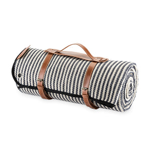 With its nautical pinstripes and waterproof lining, this blanket calls for a romantic picnic under a shady tree or a sunny lunch at the beach. A genuine leather carrier and four picnic stakes are conveniently included for a carefree outdoor date. Includes genuine leather carrier & 4 picnic stakes. Waterproof lining. Nautical pinstripe details. Makes a great gift.